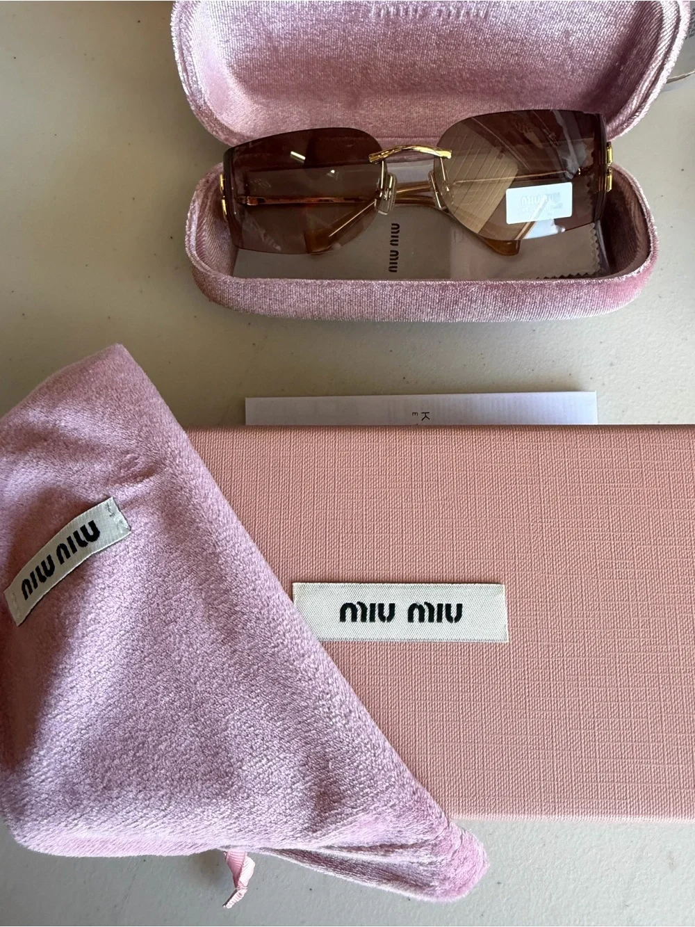 Miu Miu Women's Rimless Sunglasses in Brown
